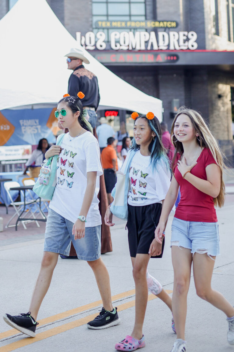 A group of friends walking through the street