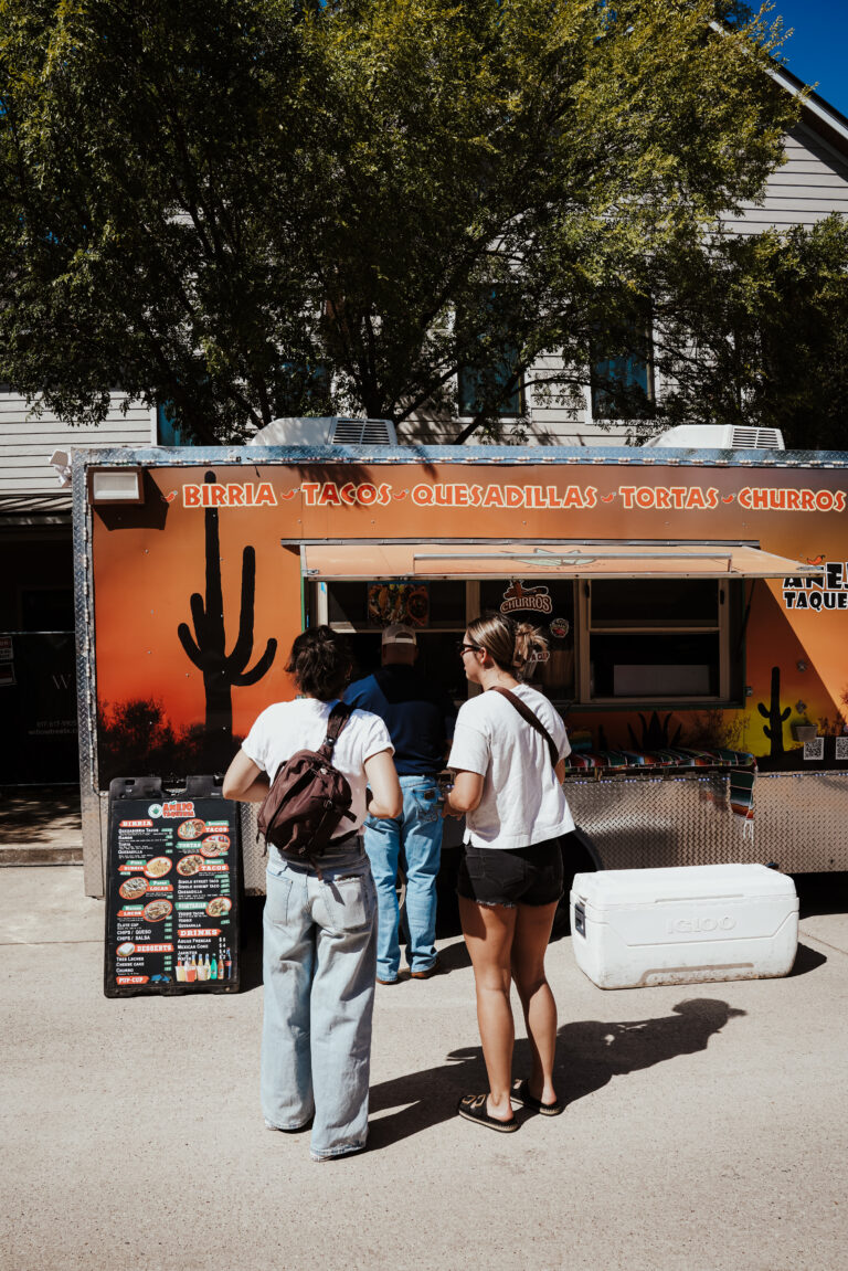 Añejo tequila food truck serving people